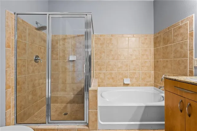a bathroom with a shower and a bathtub