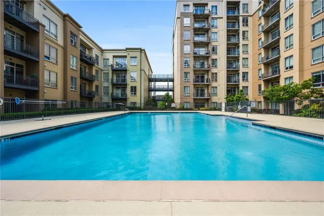 a view of an apartment building with many windows