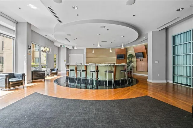 an outdoor space with dining table and sofas