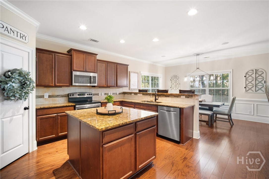 106 Danbury Court Pooler, GA 31322 - Photo 10 of 46 Kitchen with island and dining room