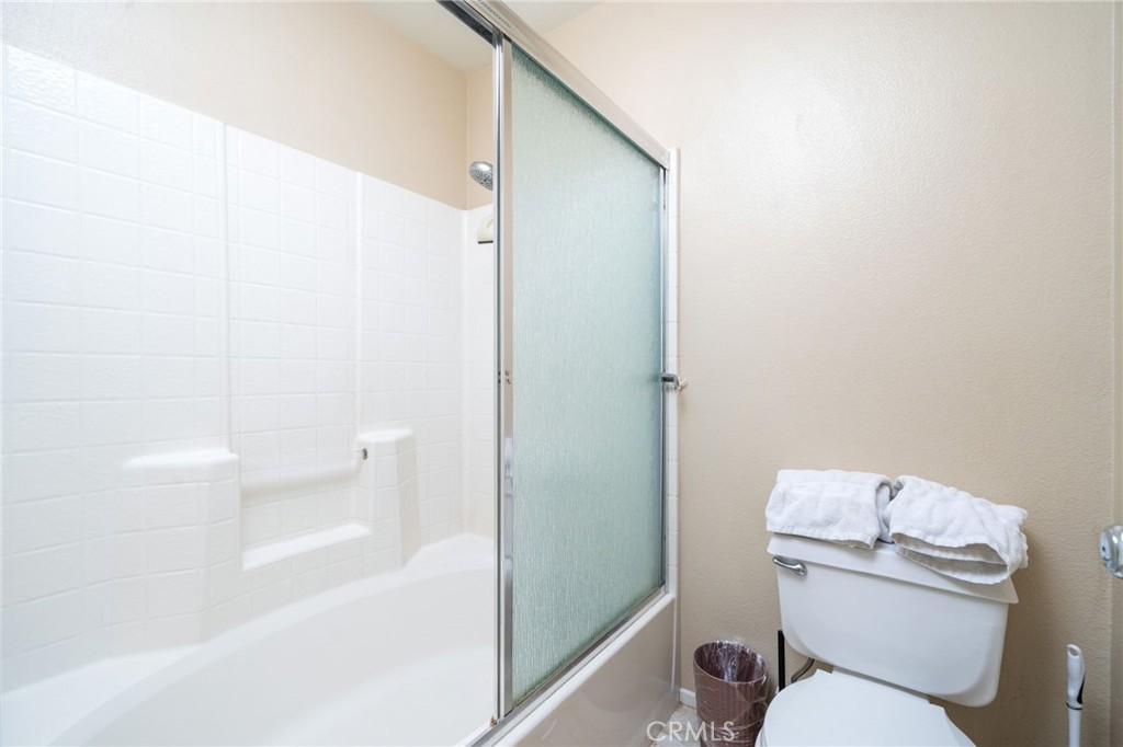 3707 Calle Curacso Riverside, CA 92503 - Photo 21 of 43 a white toilet sitting next to a bathroom sink