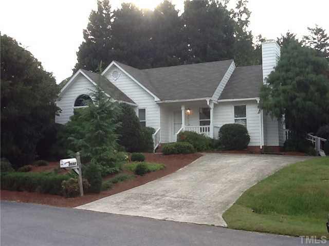 3032 Chippendale Road Raleigh, NC 27604 - Photo 1 of 23 a front view of a house with a garden and trees