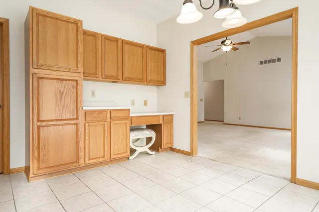 a kitchen with stainless steel appliances a refrigerator a stove a microwave a sink and cabinets