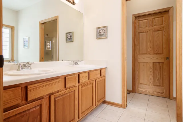 a white bath tub sitting next to a window