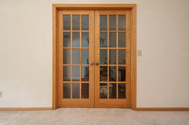 a view of a kitchen with a dishwasher cabinets and a floor to ceiling window
