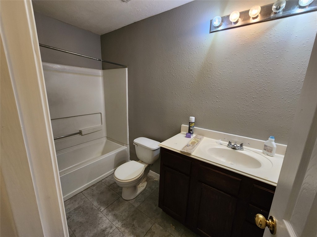 23107 Kimberly Glen Lane Spring, TX 77373 - Photo 8 of 8 a bathroom with a sink a toilet and shower