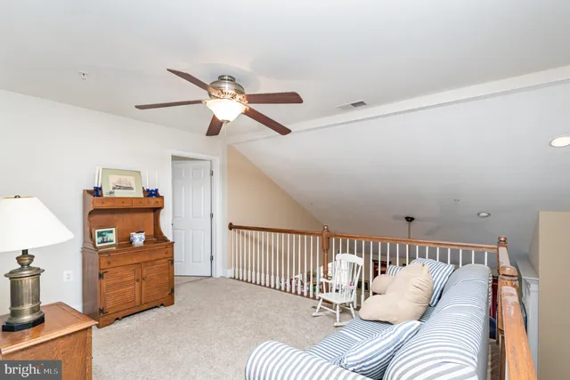 a view of a dining room with furniture and window