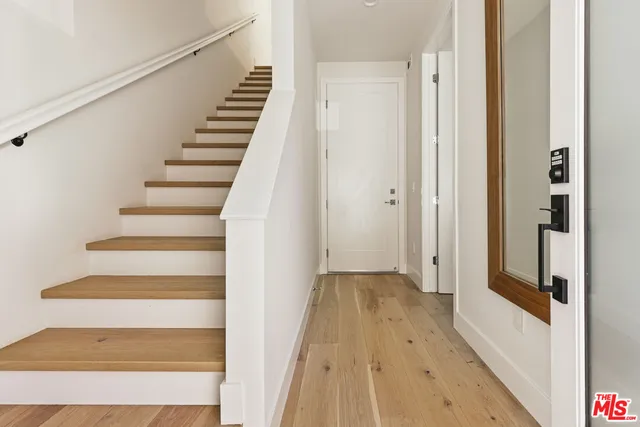 a view of entryway with wooden floor