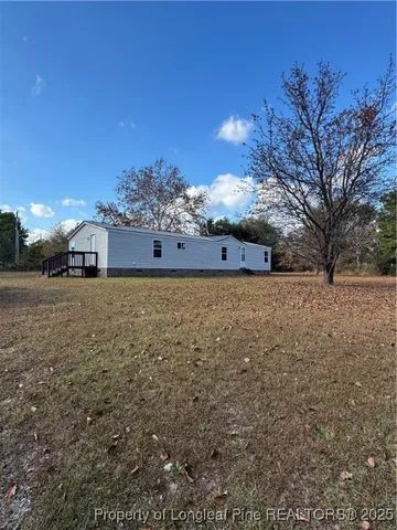 a view of a house with a big yard
