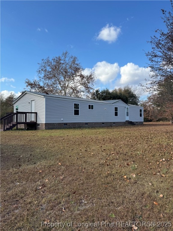 110 Flynn McPherson Road Cameron, NC 28326 - Photo 17 of 19 a view of a house with a yard