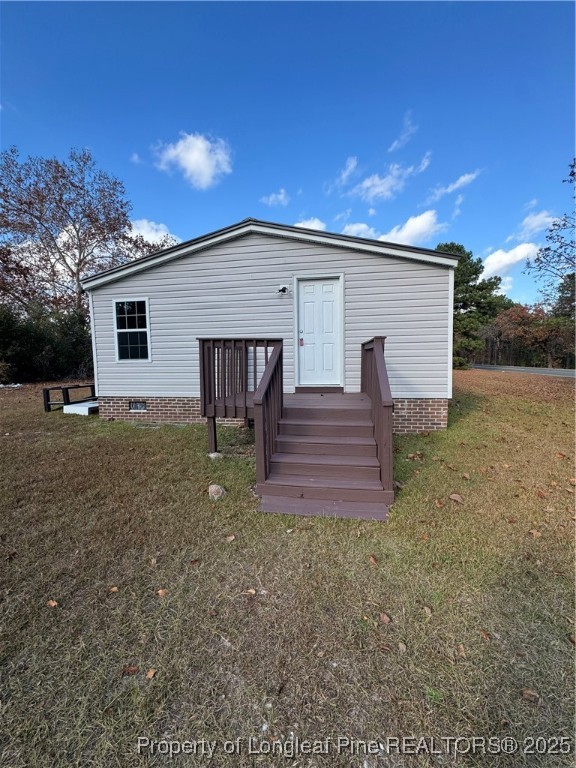 110 Flynn McPherson Road Cameron, NC 28326 - Photo 19 of 19 a view of a house with backyard and trees