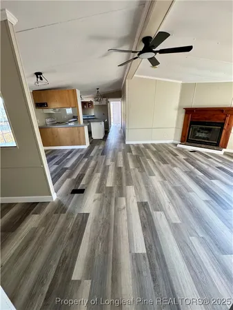 a view of a room with wooden floor