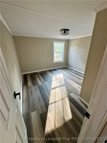 a bathroom with a sink a toilet a mirror and shower curtain