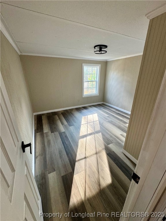 110 Flynn McPherson Road Cameron, NC 28326 - Photo 9 of 19 a view of an empty room with wooden floor and a window
