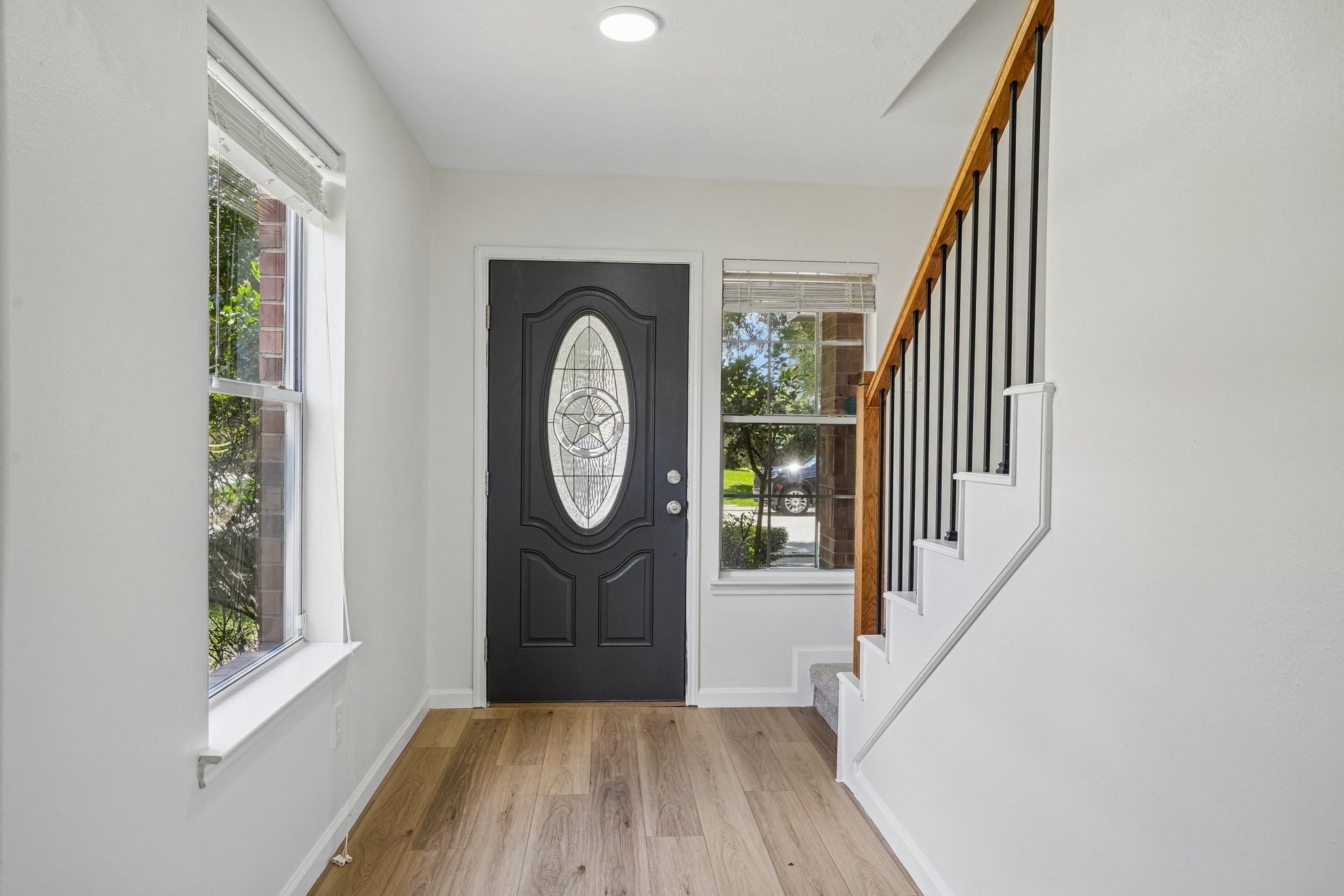4419 Crossvine Avenue Baytown, TX 77521 - Photo 2 of 38 View of the front entrance and beautiful iron baluster stairs.