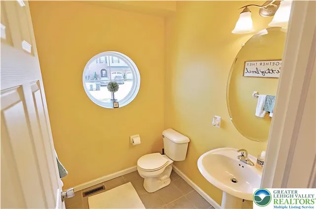 a bathroom with a toilet and a sink