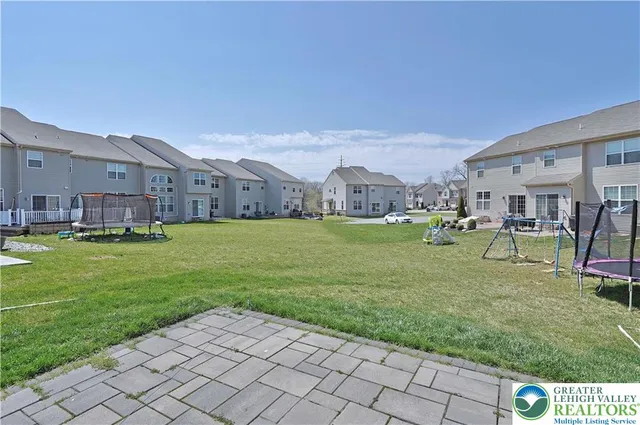 a view of a house with a garden and yard