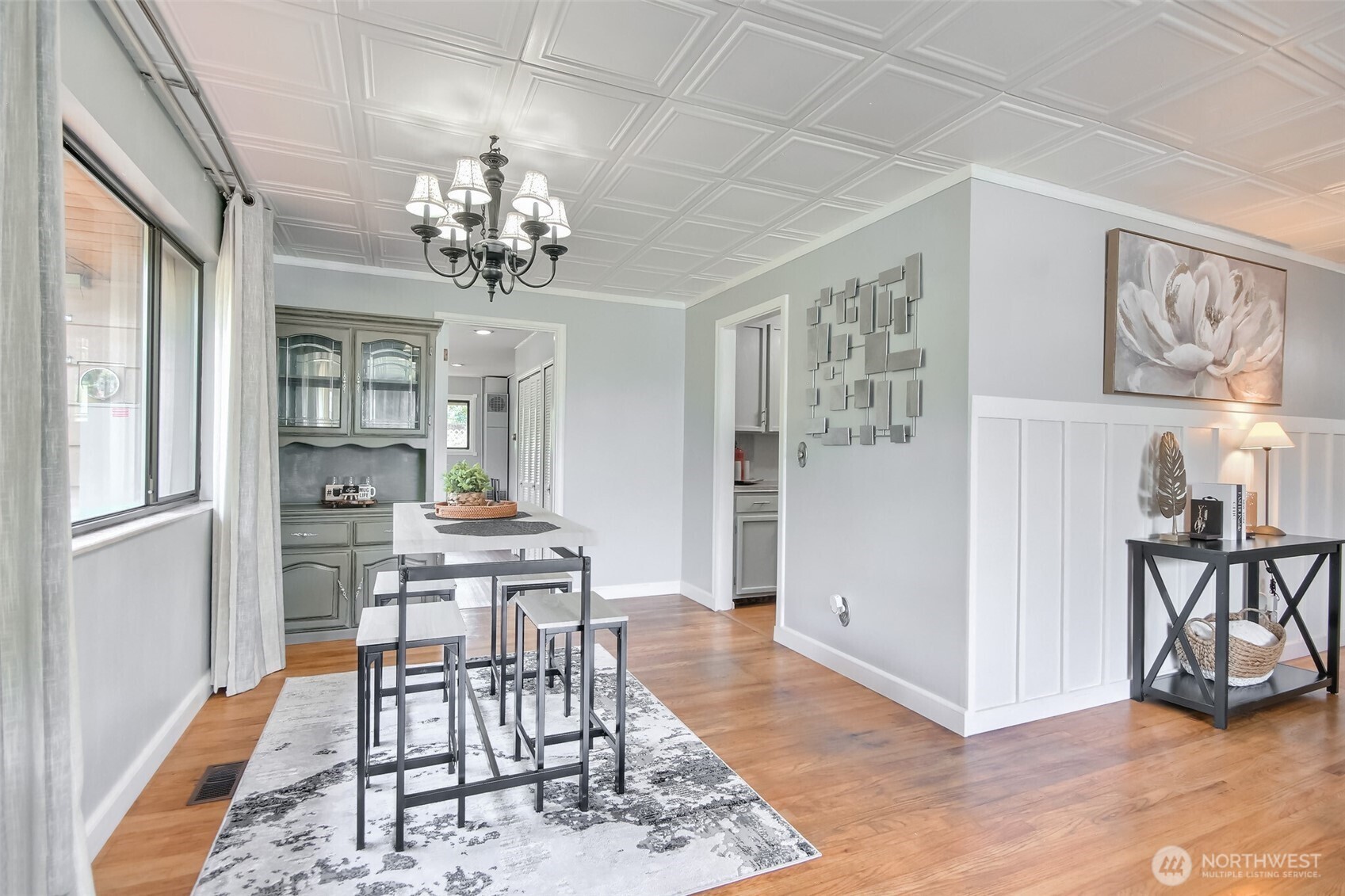 3033 Northeast 7th Street Renton, WA 98056 - Photo 9 of 31 a view of a dining room with furniture and a chandelier