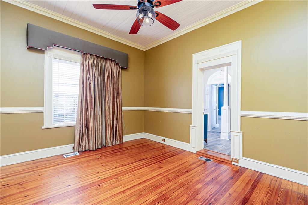 176 Confederate Avenue Dallas, GA 30132 - Photo 13 of 51 a view of empty room with wooden floor and fan
