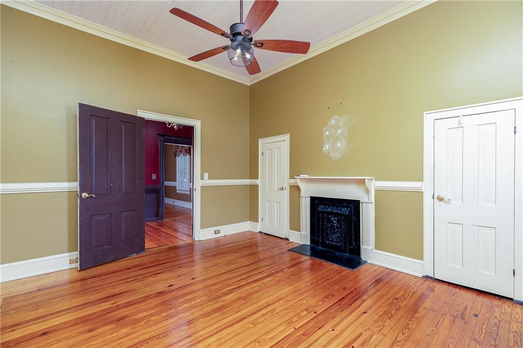 176 Confederate Avenue Dallas, GA 30132 - Photo 14 of 51 wooden floor fireplace and windows in a room