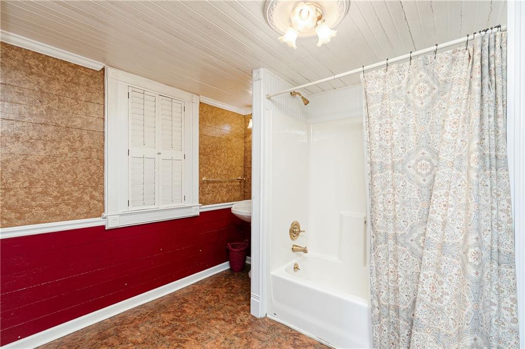 176 Confederate Avenue Dallas, GA 30132 - Photo 18 of 51 a bathroom with a bathtub and a shower