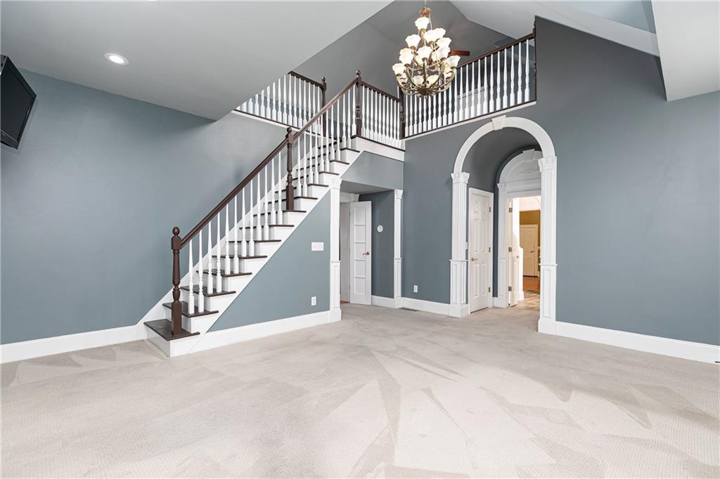 176 Confederate Avenue Dallas, GA 30132 - Photo 23 of 51 en view interior of a house with stairs and a chandelier