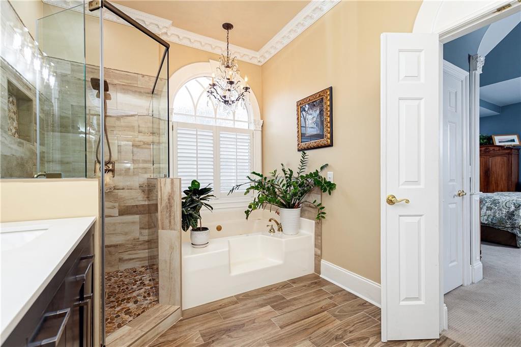 176 Confederate Avenue Dallas, GA 30132 - Photo 31 of 51 a view of a bathroom with a tub shower and mirror