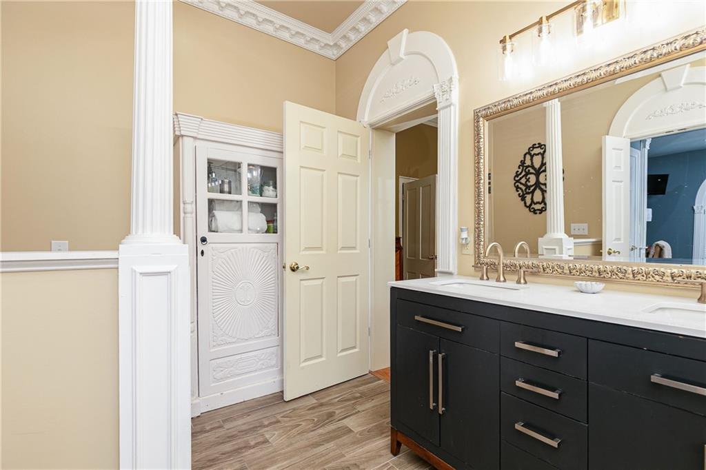 176 Confederate Avenue Dallas, GA 30132 - Photo 32 of 51 a bathroom with a granite countertop sink and a mirror