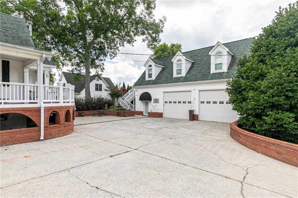 176 Confederate Avenue Dallas, GA 30132 - Photo 33 of 51 a front view of a building with garden
