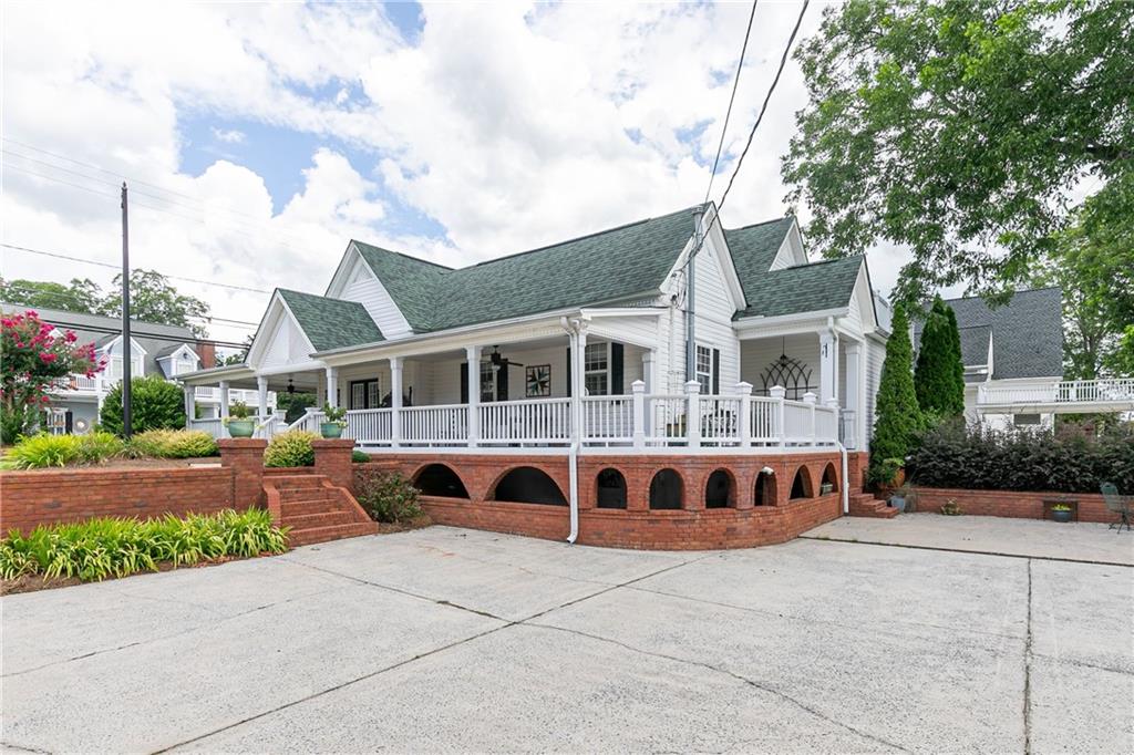 176 Confederate Avenue Dallas, GA 30132 - Photo 34 of 51 a front view of a house with garden
