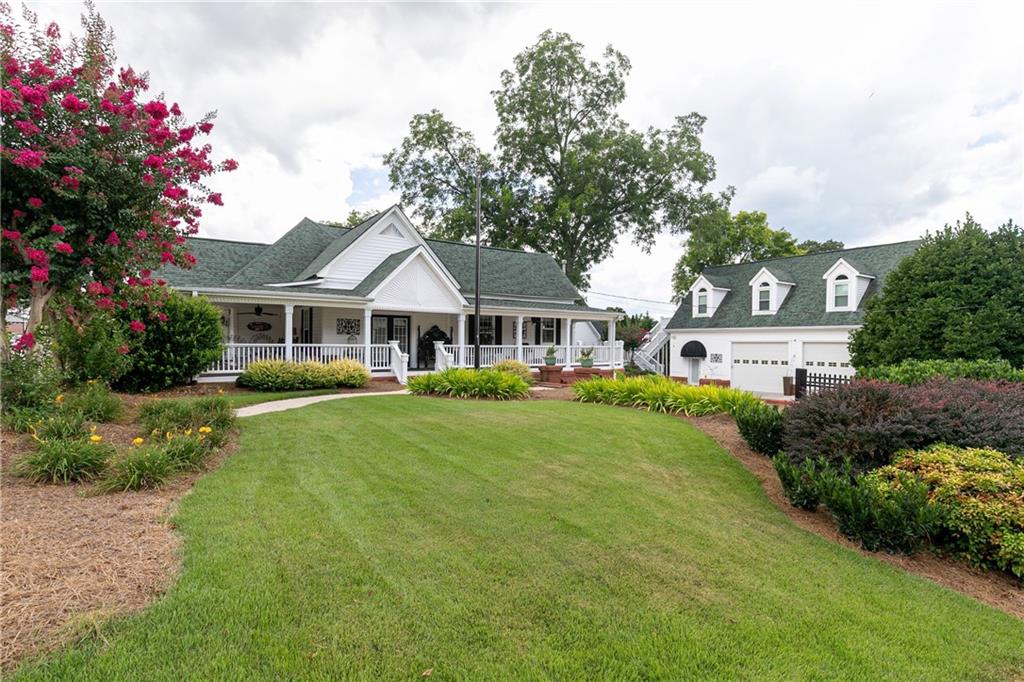 176 Confederate Avenue Dallas, GA 30132 - Photo 35 of 51 a front view of a house with a yard and trees