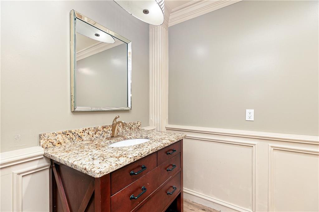176 Confederate Avenue Dallas, GA 30132 - Photo 39 of 51 a bathroom with a granite countertop sink and a mirror