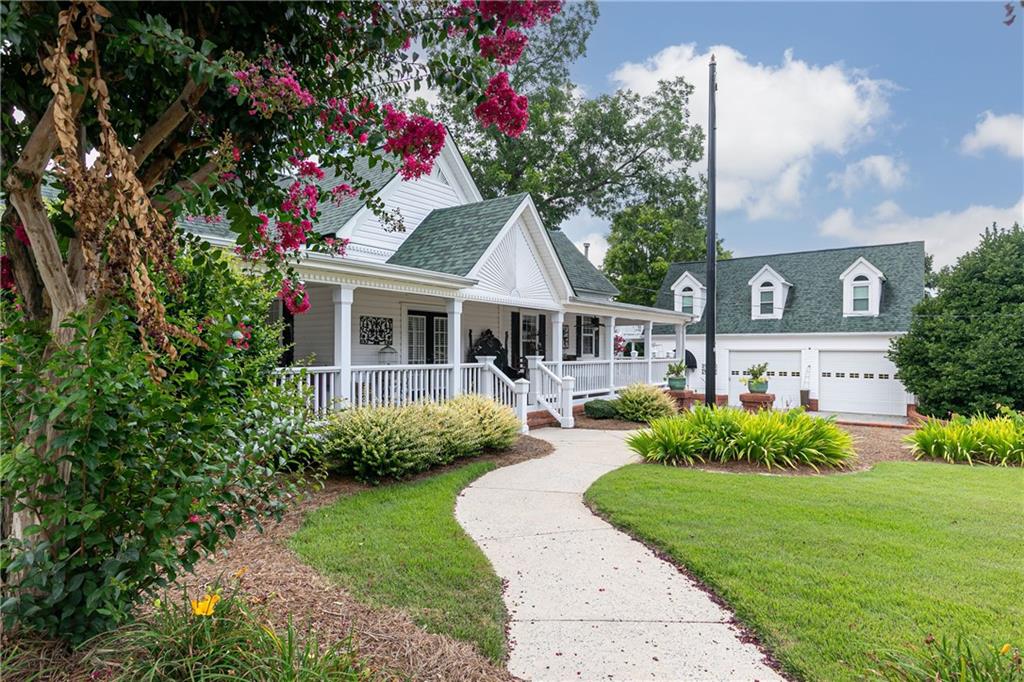 176 Confederate Avenue Dallas, GA 30132 - Photo 4 of 51 a front view of a house with garden