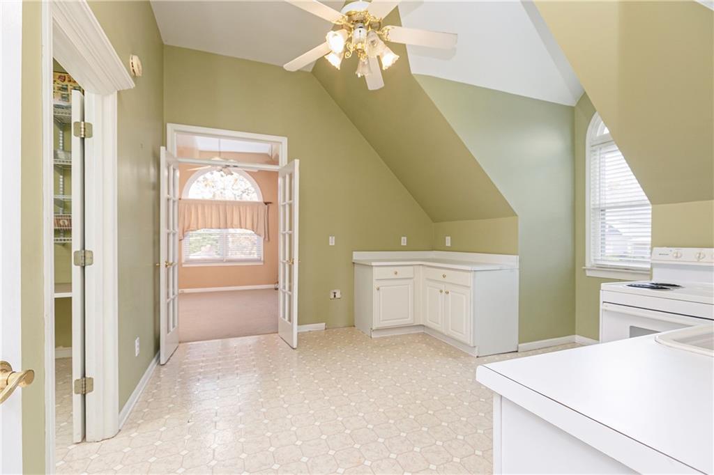 176 Confederate Avenue Dallas, GA 30132 - Photo 45 of 51 a view of a kitchen with a stove cabinets and a wooden floor