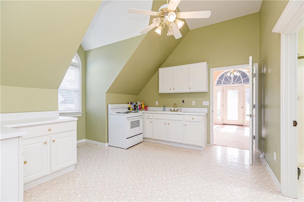 176 Confederate Avenue Dallas, GA 30132 - Photo 46 of 51 a kitchen with a cabinets and chandelier