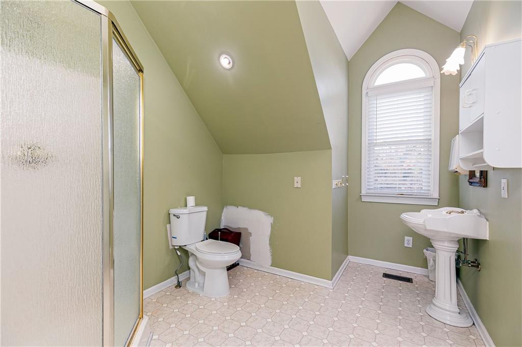 176 Confederate Avenue Dallas, GA 30132 - Photo 47 of 51 a bathroom with a toilet sink and a mirror