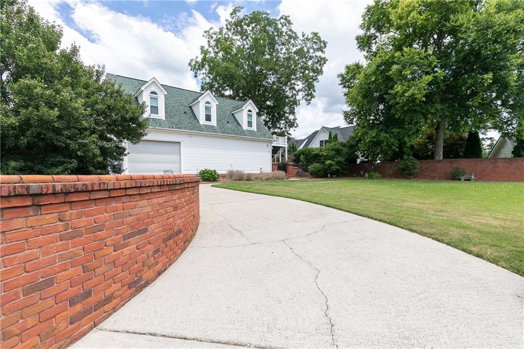 176 Confederate Avenue Dallas, GA 30132 - Photo 49 of 51 a view of yard with swimming pool and trees in the background