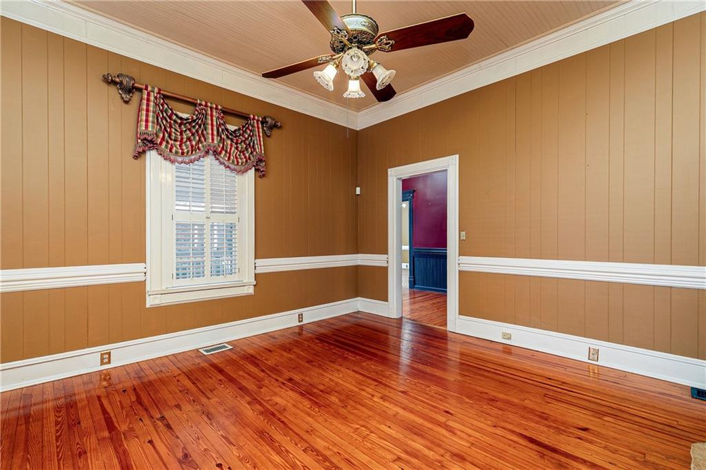 176 Confederate Avenue Dallas, GA 30132 - Photo 7 of 51 a view of an empty room with window and wooden floor