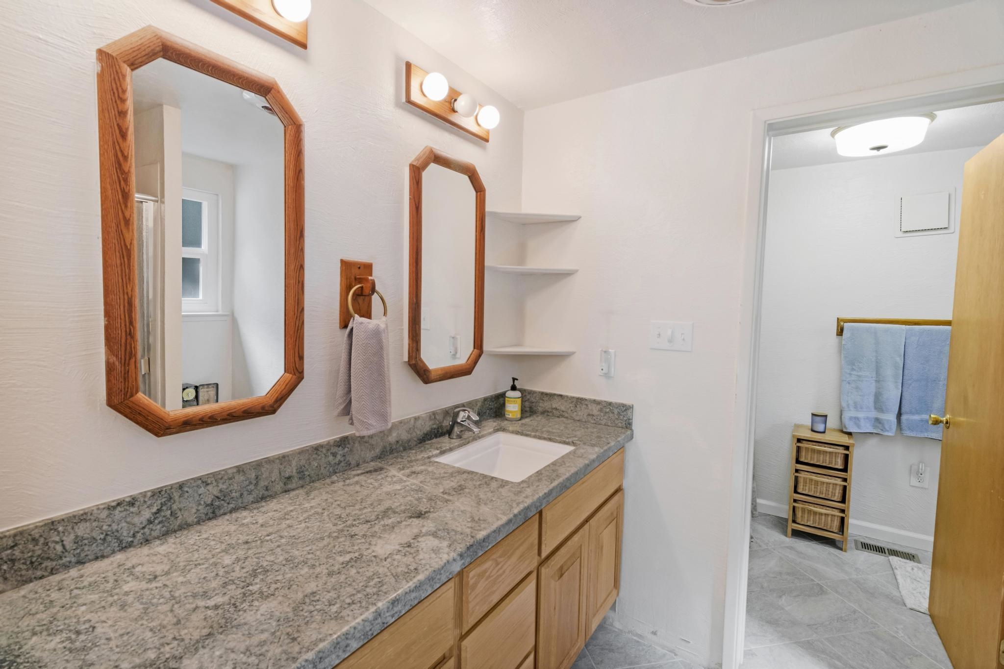 41158 Skyline Drive Emigrant Gap, CA 95715 - Photo 13 of 21 a bathroom with a granite countertop sink and a mirror