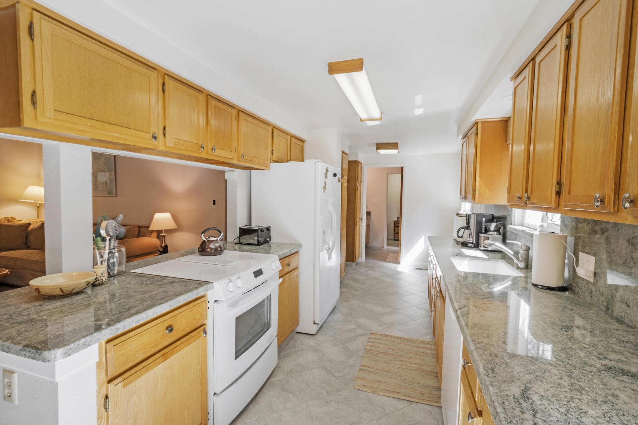 41158 Skyline Drive Emigrant Gap, CA 95715 - Photo 4 of 21 a kitchen with a sink stove and refrigerator