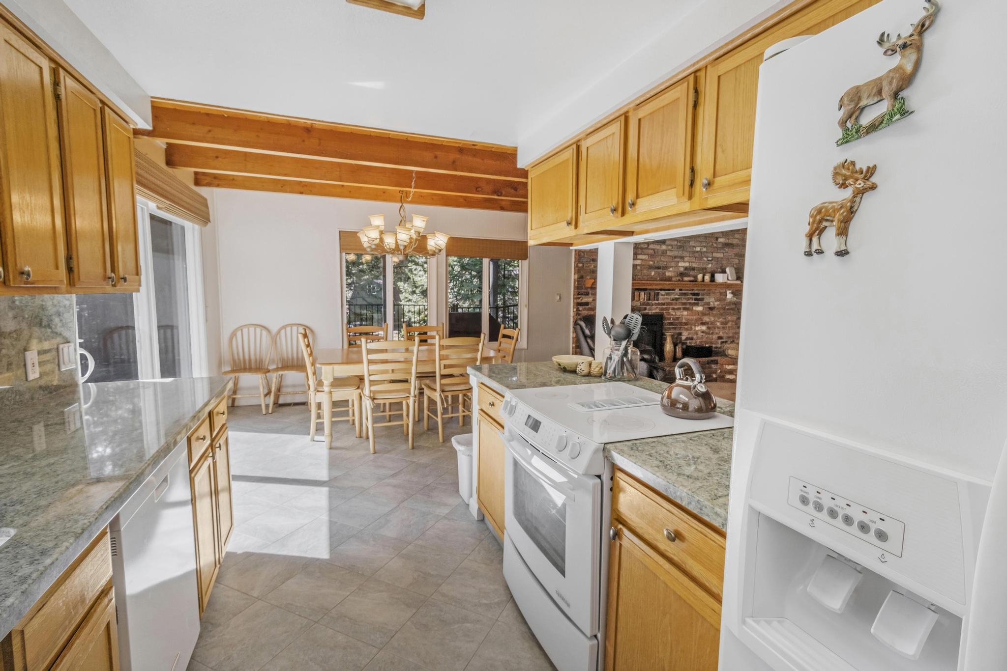 41158 Skyline Drive Emigrant Gap, CA 95715 - Photo 5 of 21 a kitchen with granite countertop a sink and a stove top oven