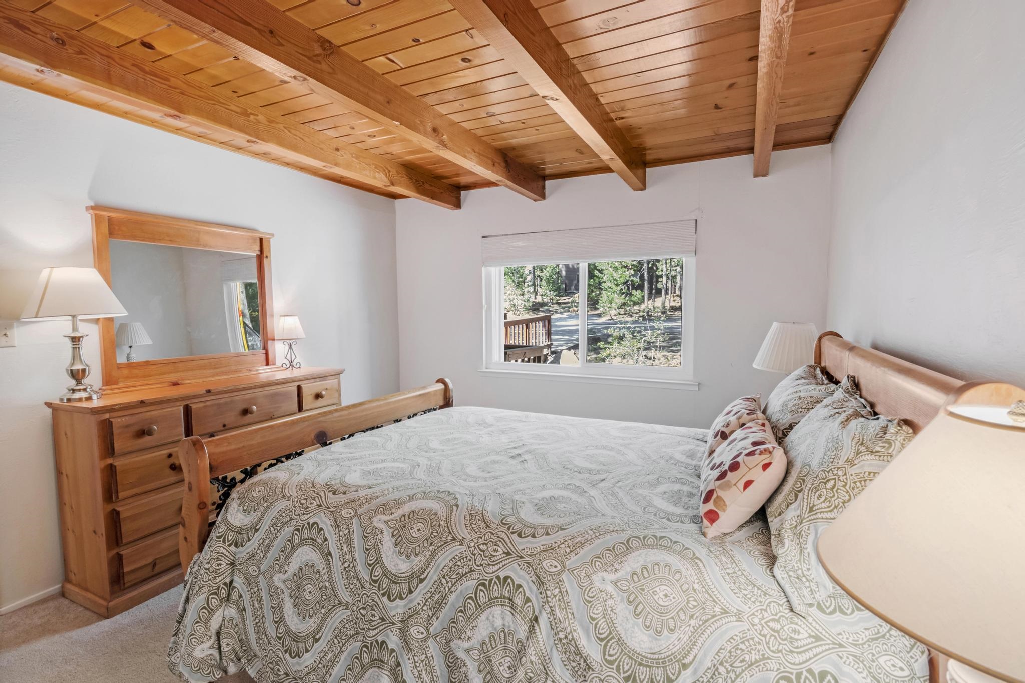 41158 Skyline Drive Emigrant Gap, CA 95715 - Photo 7 of 21 a bedroom with a bed and a dresser