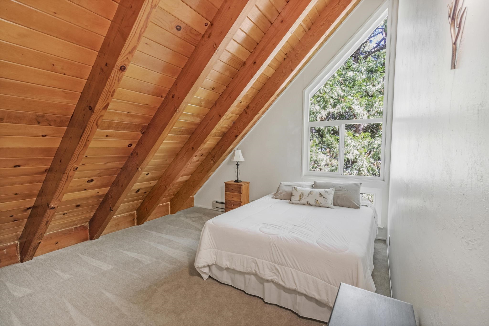 41158 Skyline Drive Emigrant Gap, CA 95715 - Photo 9 of 21 a bedroom with a bed and a window