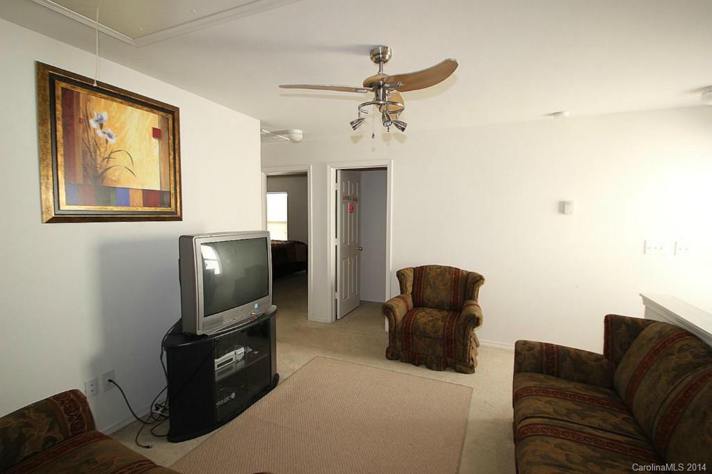 8941 Chalkstone Road Charlotte, NC 28216 - Photo 11 of 20 a living room with furniture and a flat screen tv
