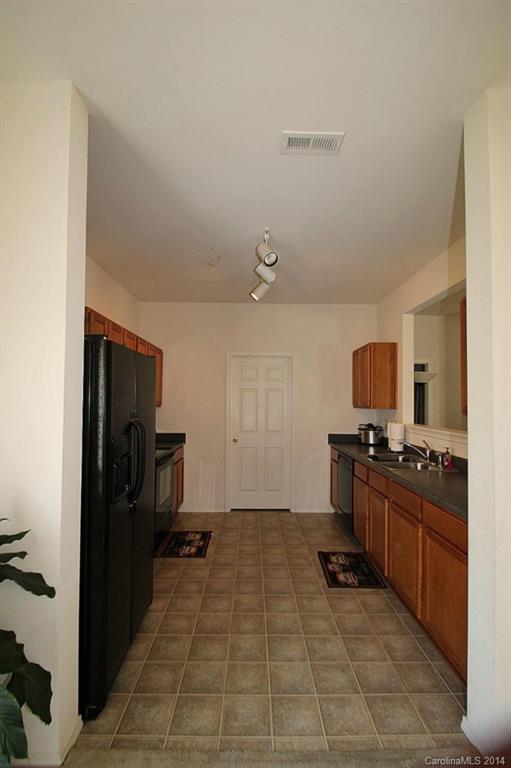 8941 Chalkstone Road Charlotte, NC 28216 - Photo 5 of 20 a kitchen with a stove a refrigerator and a stove