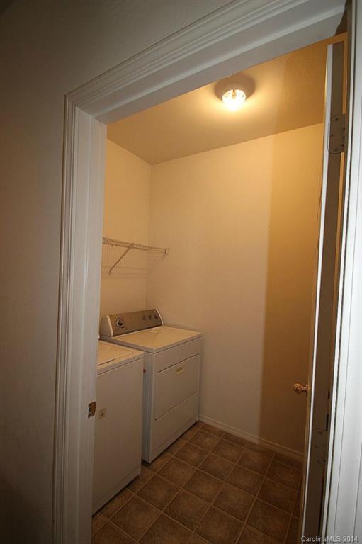 8941 Chalkstone Road Charlotte, NC 28216 - Photo 6 of 20 a room with a washer and dryer