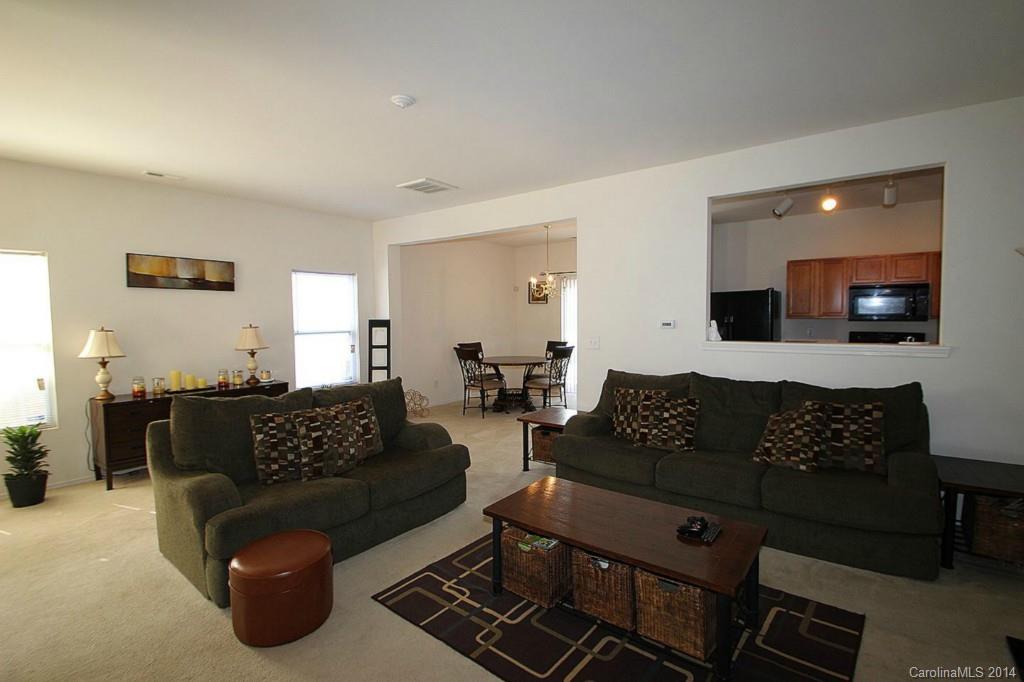 8941 Chalkstone Road Charlotte, NC 28216 - Photo 10 of 20 a living room with furniture and a couch