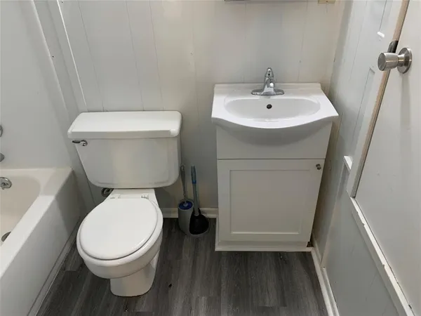 a kitchen with granite countertop a sink and a stove top oven