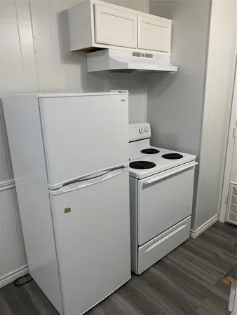 a storage room with wooden floor