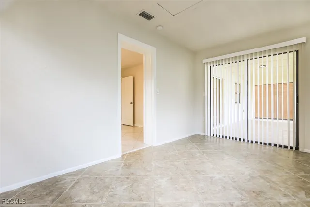 an empty room with a empty space and windows